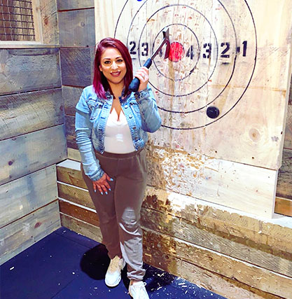 A woman axe throwing