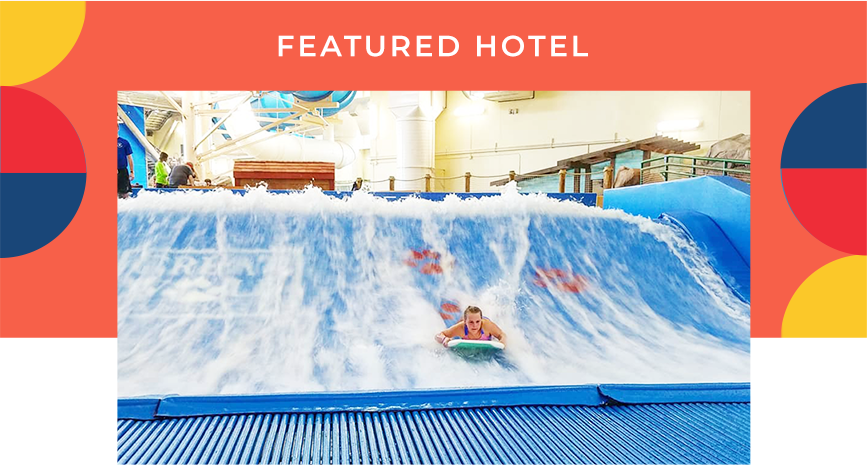 A kid riding a boogie board on a wave generator. A heading reads: Featured Hotel