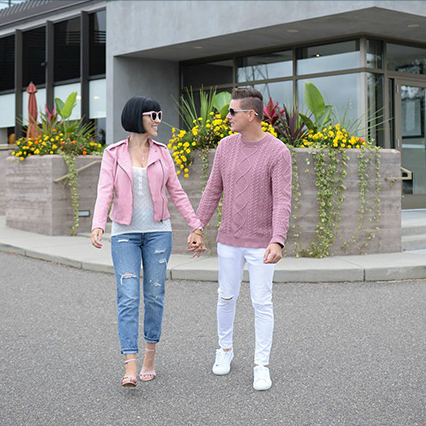 A couple of fashanistas walking outside the mall. 