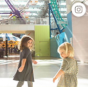 Two kids walking through the Mall of America 