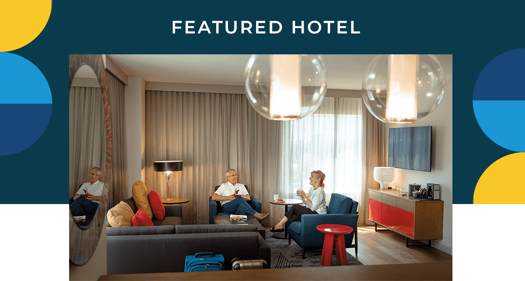 Featured Hotel - A group of people in a hotel room.