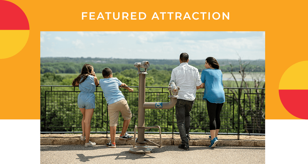 Featured Attraction - A group of people looking over a ledge.