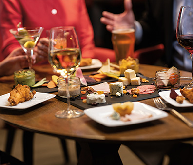 A table full of food and drinks.