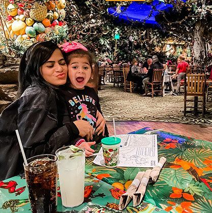 A mother and daughter at a dinner table